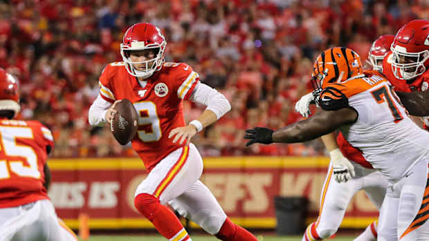 Kansas City Chiefs quarterback Kyle Shurmur (9) runs against Cincinnati Bengals defensive end Christian Ringo (79) during the first half at Arrowhead Stadium.